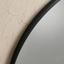 Okrągłe lustro ścienne w metalowej ramie, Ø 70 cm, czarne